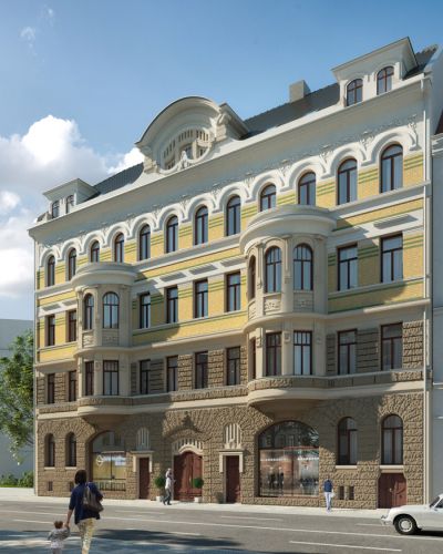 Historische Altbaufassade mit Erker und Stuckdetails in renovierter Stadtvilla an einer belebten Straße mit Fußgängern und Autos.